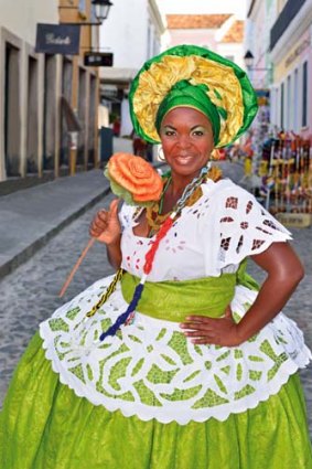 A woman in traditional Candomble dress in the historic centre of Salvador da Bahia.