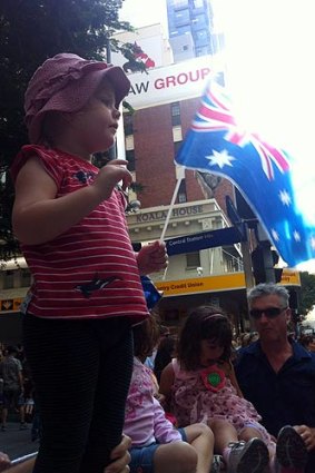 Nadia Grenier, 2, cheers on veterans and soldiers in the Anzac Day parade.