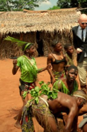 Mads Brudder dances with locals in a scene from <i>The Ambassador</i>.