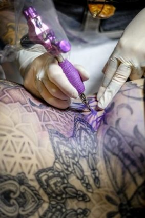 Tattooist Stacey Molly adds colour.