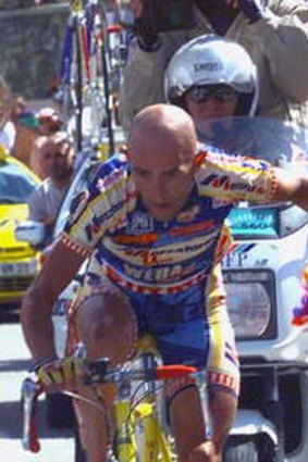Marco Pantani pushes a spectator back during his climb at l'Alpe d'Huez in the 1997 Tour de France.