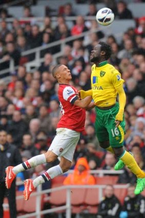 Arsenal defender Kieran Gibbs (left) vies with Norwich City striker Kei Kamara during the match on Saturday.