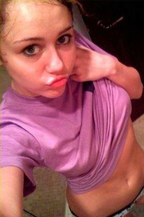 Actor Miley Cyrus poses for a selfie.