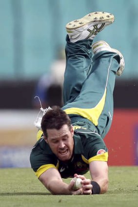 Hands full: Australian bowler Daniel Christian takes the disputed catch.