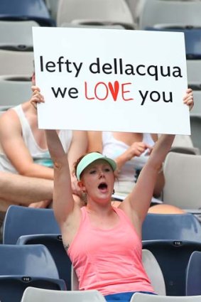 A fan holds up a sign in support of Casey Dellacqua.