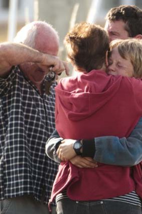 Loved ones at the scene react to the news.