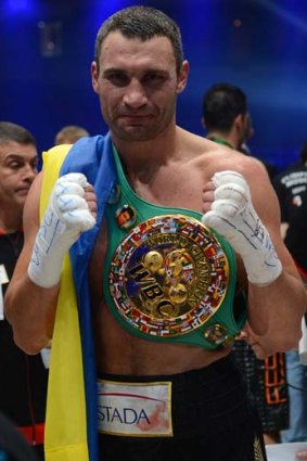 Ukraine's Vitali Klitschko celebrates after he successfully defended his WBC heavyweight title against Germany's Manuel Charr in Moscow, September 9, 2012.