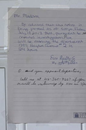 A notice is posted on a door, where a  35-year-old registered sex offender was arrested Friday in East Cleveland, Ohio.