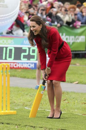 The Duchess of Cambridge trying her hand at some cricket, in high heels.