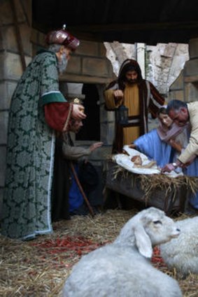 A Palestinian man sets up a crib at the Church of Nativity in Bethlahem.