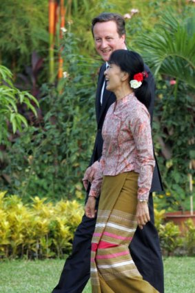 British Prime Minister David Cameron and Burmese pro-democracy icon Aung San Suu Kyi share a light moment during their meeting in the compound of her lakeside home  in Yangon.