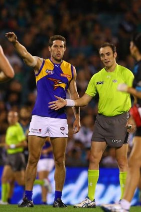 Darren Glass is reported during the Eagles' match against Port Adelaide.
