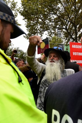 Lyle Davis (centre) during the protest. 