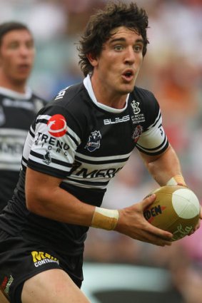 Joel Reddy of the Tigers runs the ball during the round five NRL match