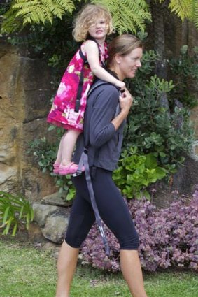 Laura Haldane, of Balgowlah Heights, with her two year old daughter Grace in the Piggyback Rider.