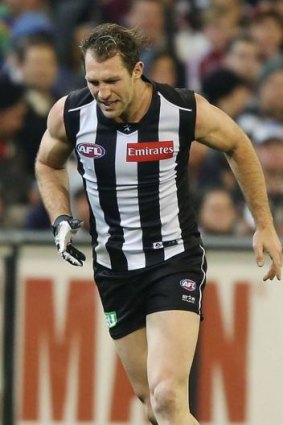 Travis Cloke hobbles off the ground.
