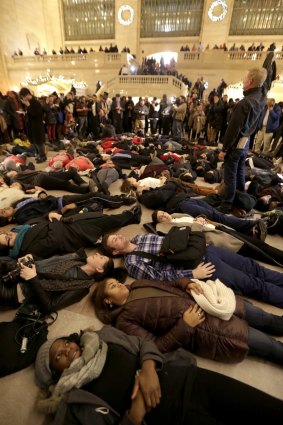 Protesters stage a "die-in" at New York's Grand Central Station after the decision was announced.