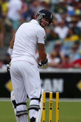 Kevin Pietersen looks at his stumps after he was bowled by Peter Siddle.