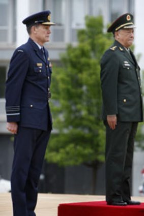 Salute  ... the Australian Defence Force head Angus Houston and the People’s Liberation Army chief of general staff, General Chen Bingde, during a guard of honour in Canberra yesterday.