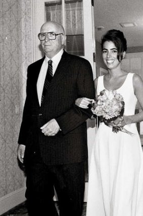 Here comes the bride: Amelia Wallace and her father at her wedding in New York.