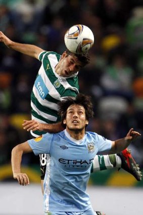 Collision &#8230; Sporting's Emiliano Insua and City's David Silva.