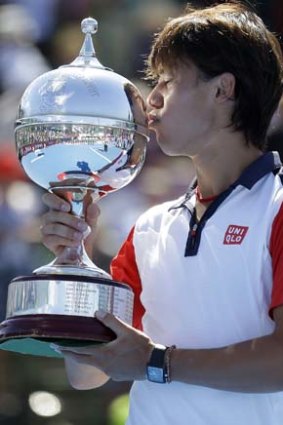 Sealed with a kiss: Japan's Kei Nishikori after winning the AAMI Classic.