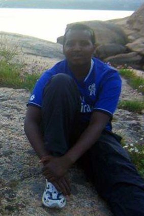 From student to gunman: Hassan Abdi Dhuhulow in Chelsea blue during a school outing in 2007.