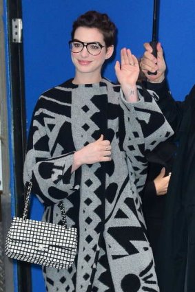 Bon draper: Anne Hathaway enveloped in a Burberry Prorsum cloth coat.