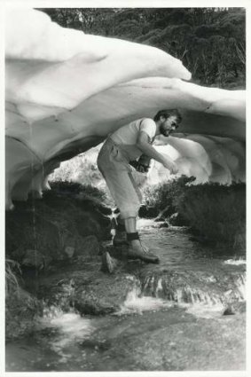 Klaus inside a snow tunnel on a tributary to Guthega River during a walk up Rolling Grounds in 1980