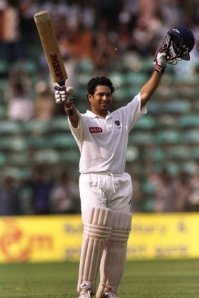 Sachin Tendulkar celebrates is century in Bangalore.