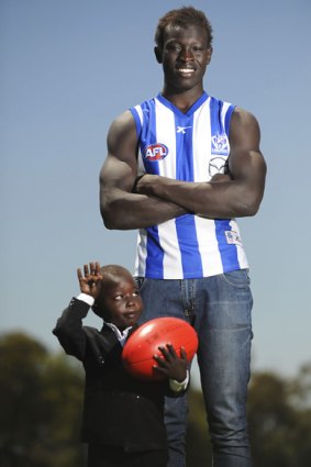 North Melbourne's newest rookie, 18-year-old Majak Daw, with his brother Ajak.