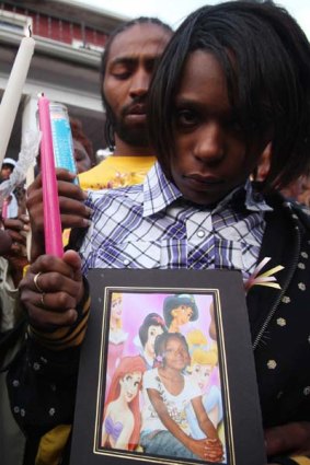 The mother and father of Aiyana Jones gather for a candle light vigil for seven-year-old daughter Aiyana Jones.