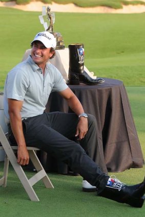 Adam Scott with part of the booty for winning the Valero Texas Open.