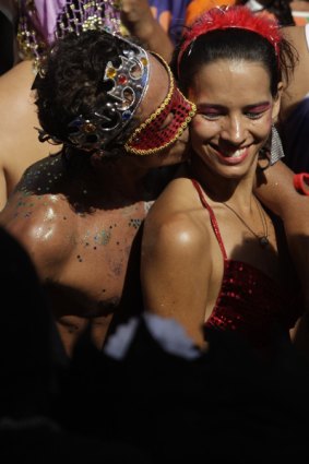 Revellers attend the Carmelitas carnival parade in Rio de Janeiro.