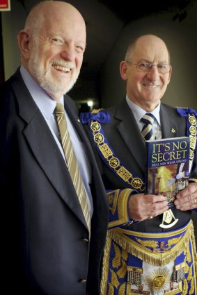 Freemason author Peter Lazar, and Grand Master of the United Grand Lodge, Garry Sebo, with Lazar's book It's No Secret - Real Men Wear Aprons.