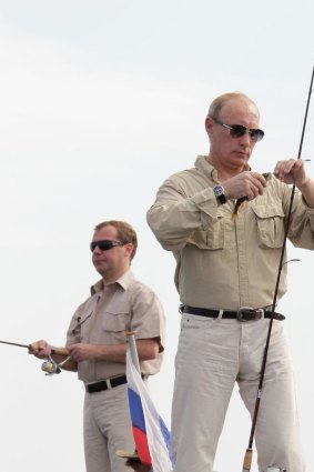 Fishing for votes: Vladimir Putin  and Dmitry Medvedev.