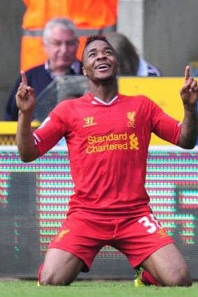 Liverpool's Raheem Sterling celebrates on Sunday.