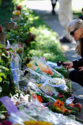 Shrine ...  mourners outside Steve Jobs's Silicon Valley home.