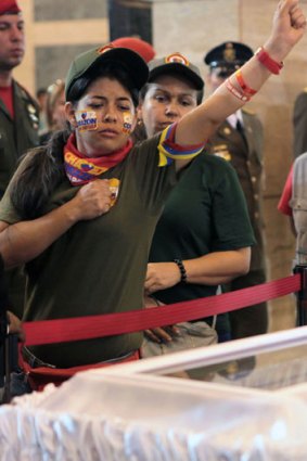 A woman reacting as she pays last tribute to the late Venezuelan President Hugo Chavez.