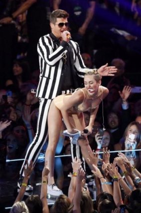 Beginning of the end? Robin Thicke and Miley Cyrus perform "Blurred Lines" during the 2013 MTV Video Music Awards.