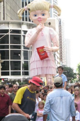 Brisbane streetgoers meet Ellie, a nine metre walking puppet brought in for the shooting of a confectionary company's advertisement.