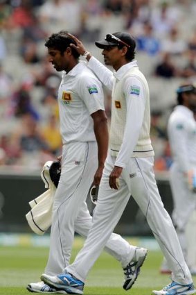 Sri Lanka's Chanaka Welgedara walks off after injuring his hamstring.