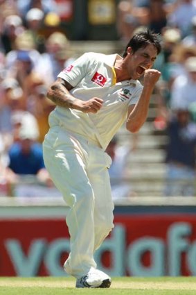 Soon it will be nine . . . Mitchell Johnson takes a scalp in Perth.
