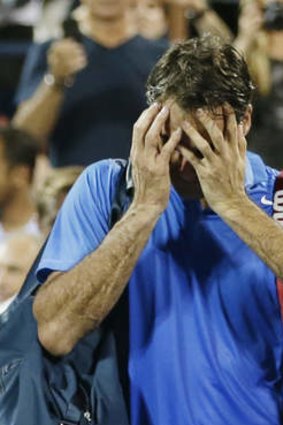 Down and out: Roger Federer.