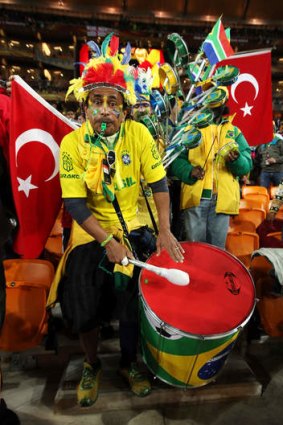 Passion: A Brazil fan at the 2010 FIFA World Cup match between Brazil and the Ivory Coast at Johannesburg.