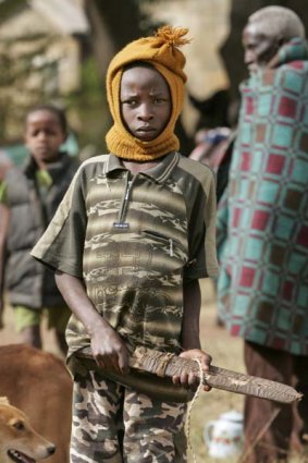 Violence . . . A Kikuyu boy armed with a machete in 2008.