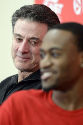 Courage: Louisville head coach Rick Pitino, left, looks on as forward Kevin Ware answers questions.