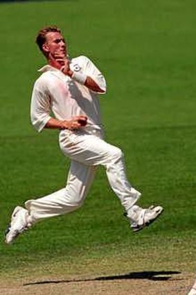 Brett Lee bowls for the Prime Minister's XI against India at Manuka Oval in December 1999.