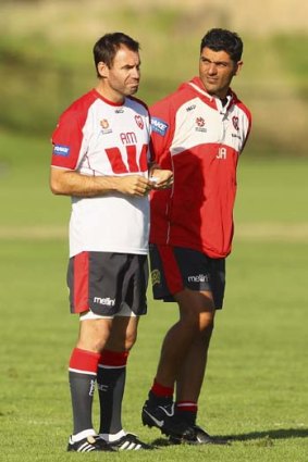 Heavy heart ... Ante Milicic and John Aloisi were assistants at Melbourne last season.