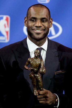 Miami Heat forward LeBron James holds the trophy after being named NBA Most Valuable Player.